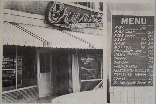 A black-and-white archival photograph of the Arthur Bryant’s storefront and hand-lettered menu board